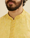 alt message - Manyavar Men Buttercup Yellow Bel Buti Patterned Kurta Set image number 1