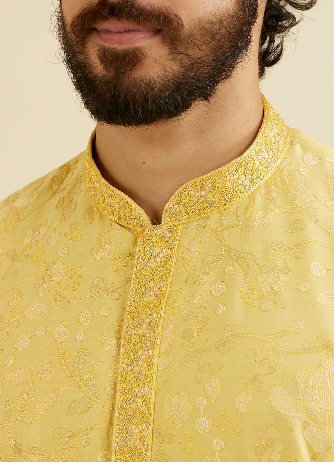 alt message - Manyavar Men Buttercup Yellow Bel Buti Patterned Kurta Set image number 1