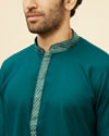 Manyavar Men Teal Blue Embroidered Neckline Kurta Set