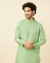 alt message - Manyavar Men Mint Green Diamond Printed Kurta Set image number 0