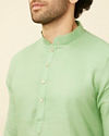 alt message - Manyavar Men Mint Green Diamond Printed Kurta Set image number 1