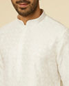 alt message - Manyavar Men White Self Patterned Kurta Set image number 1