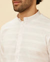 alt message - Manyavar Men Bright White Self Striped Classic Kurta Set image number 1