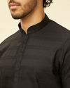 alt message - Manyavar Men Charcoal Black Self Stripe Patterned Kurta Set image number 1