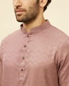 alt message - Manyavar Men Foxy Pink Chevron Patterned Kurta Set image number 1