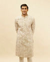 alt message - Manyavar Men Cream Overlapping Printed Kurta Set image number 0