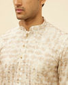 alt message - Manyavar Men Cream Overlapping Printed Kurta Set image number 1