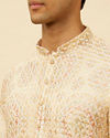 alt message - Manyavar Men Peach Beige Kaleidoscopic Patterned Kurta Set image number 1