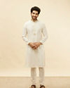 alt message - Manyavar Men Warm White Embroidered Neckline Kurta Set image number 2