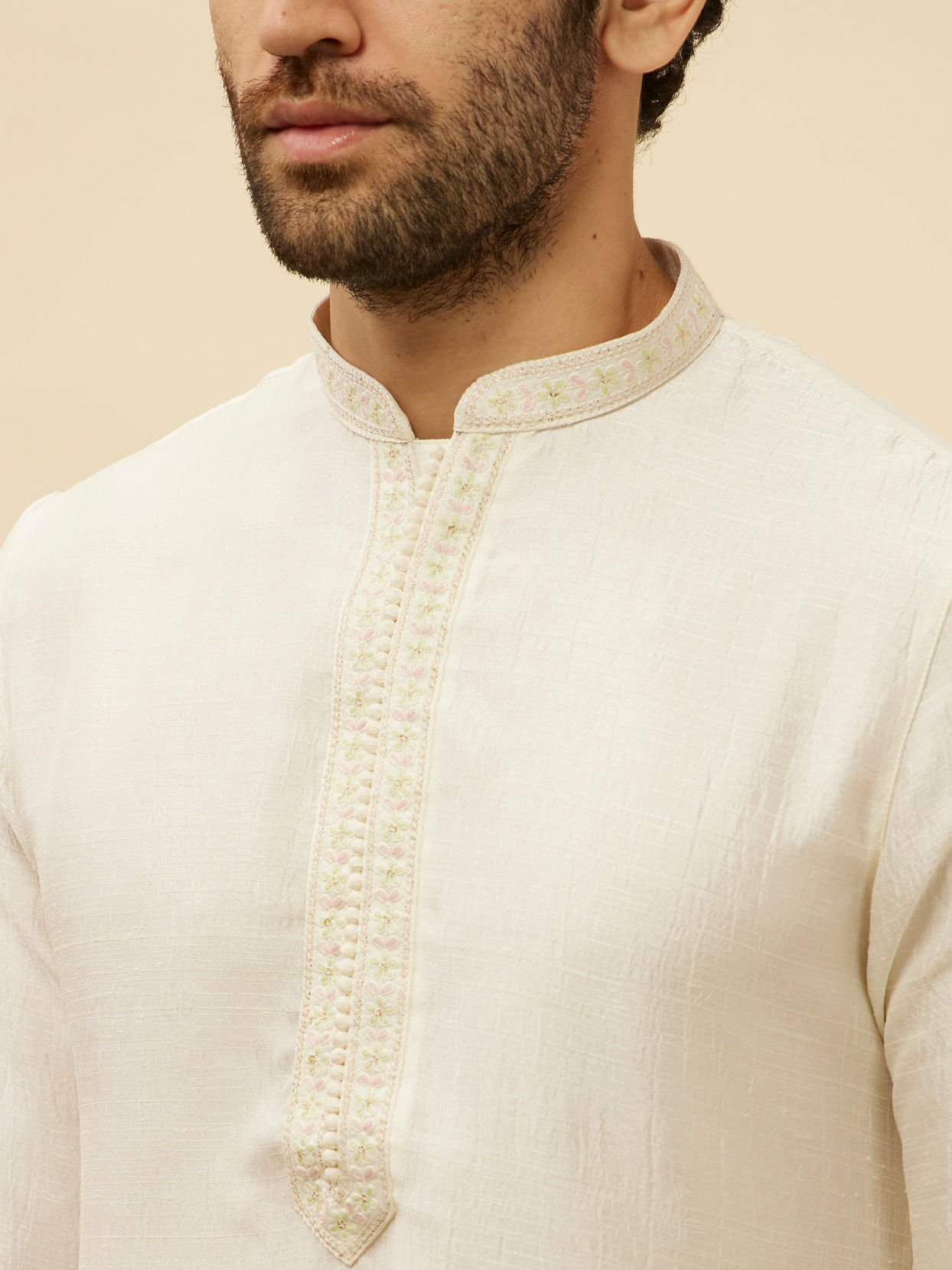 alt message - Manyavar Men Warm White Embroidered Neckline Kurta Set image number 1