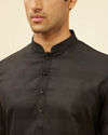 alt message - Manyavar Men Coal Black Self Patterned Kurta Set image number 1