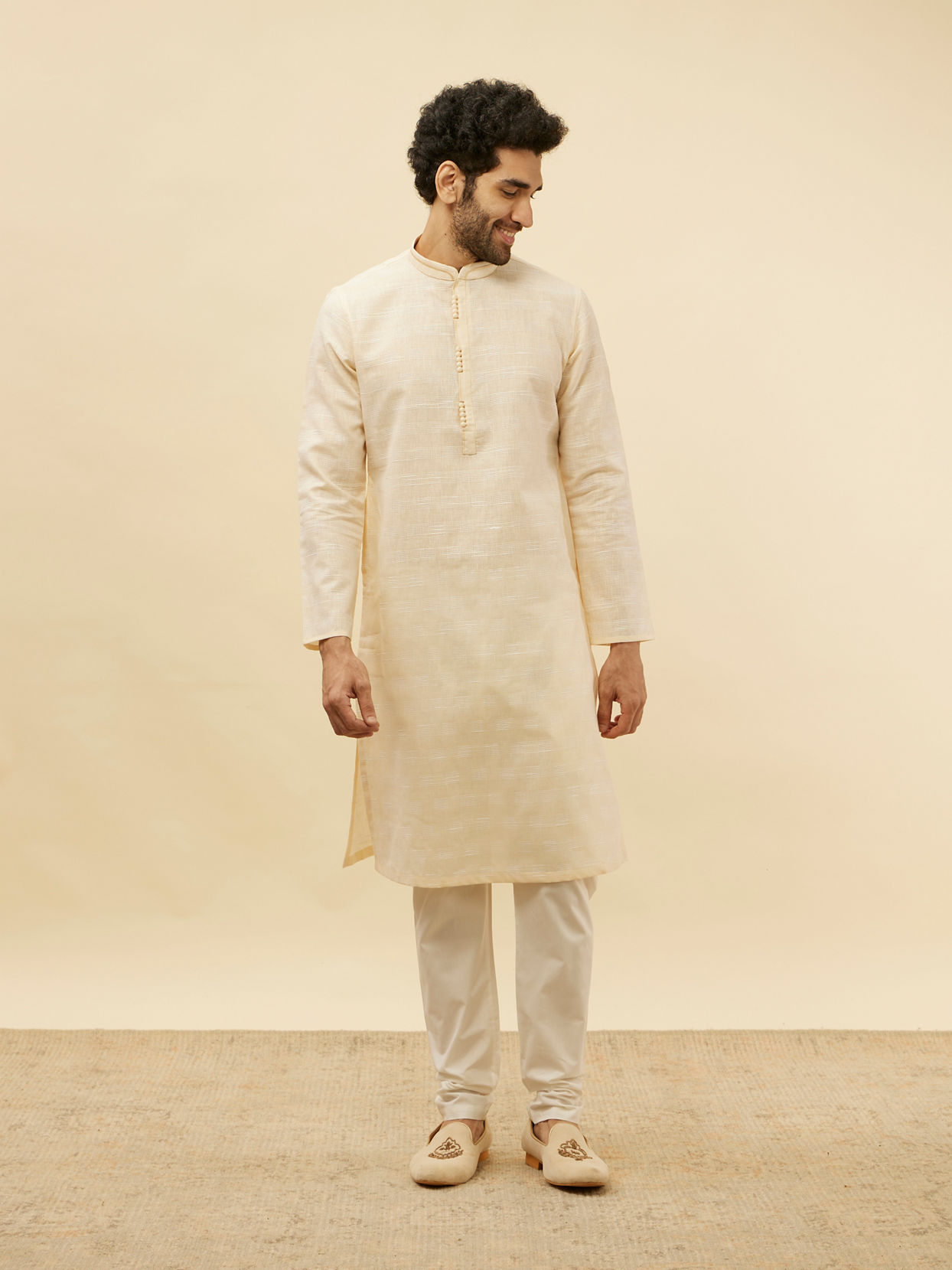 alt message - Manyavar Men Soft Cream Self Textured Kurta Set image number 2