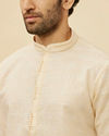 alt message - Manyavar Men Soft Cream Self Textured Kurta Set image number 1