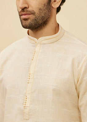 alt message - Manyavar Men Soft Cream Self Textured Kurta Set image number 1