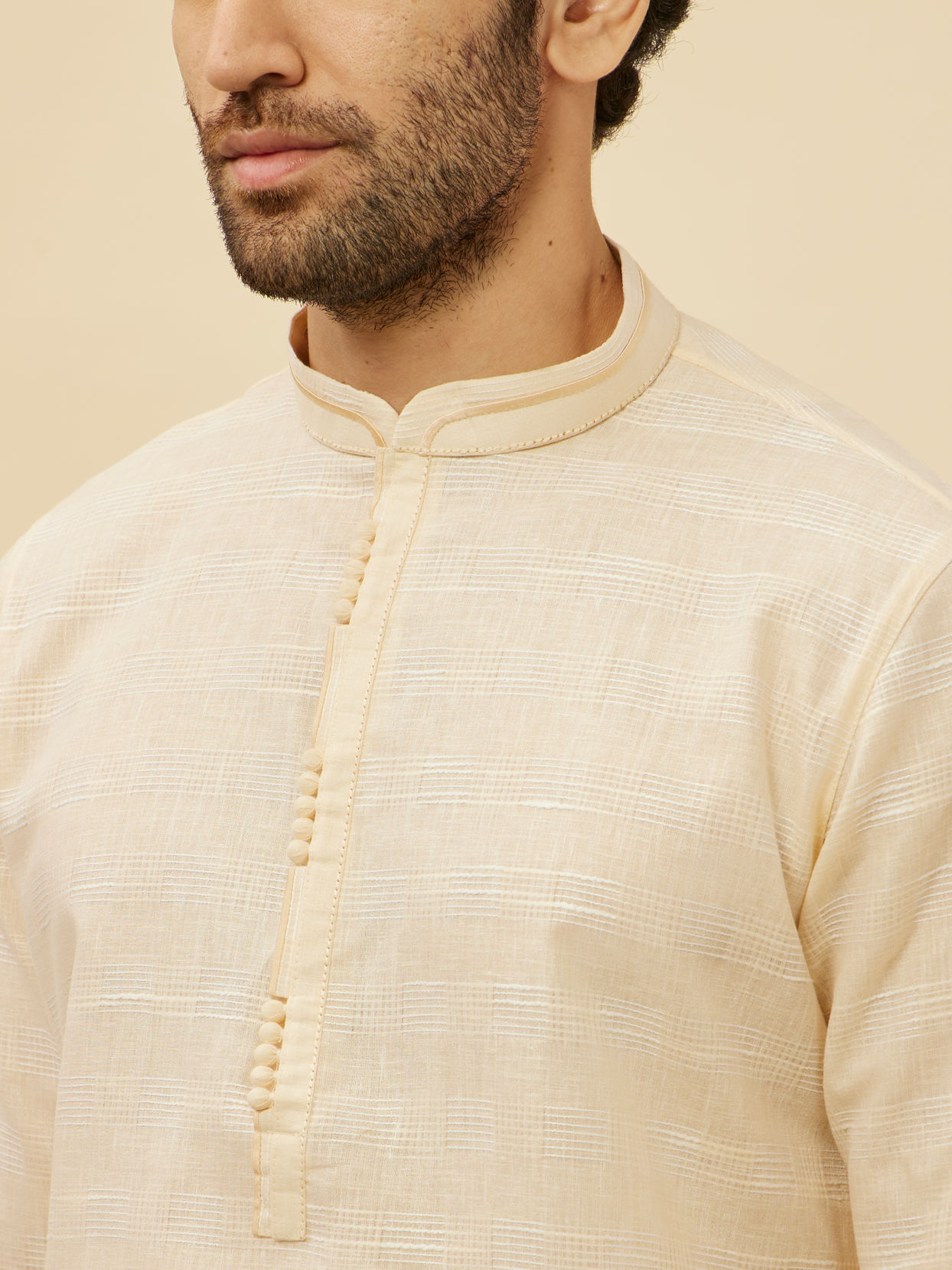 alt message - Manyavar Men Soft Cream Self Textured Kurta Set image number 1