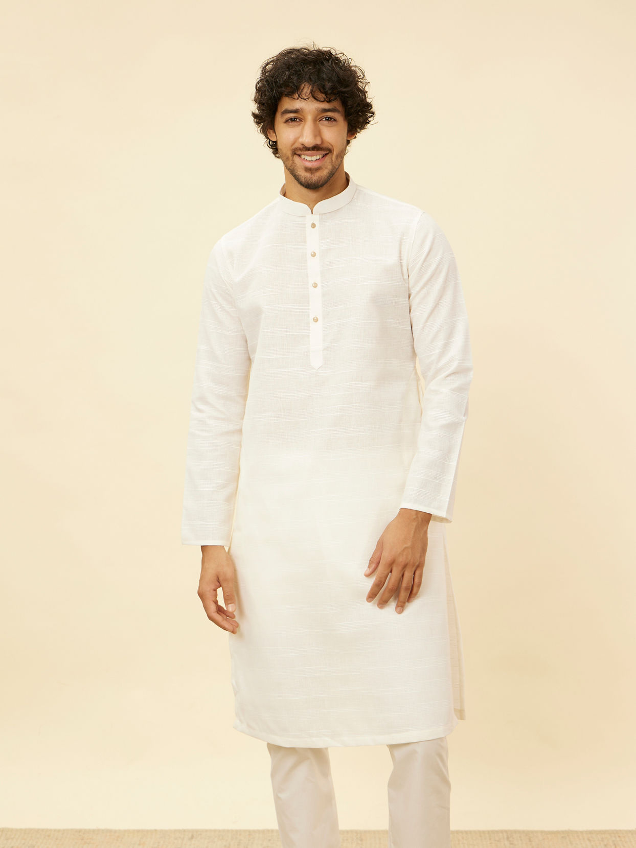 alt message - Manyavar Men Warm White Grid Patterned Kurta Set image number 0