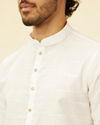 Manyavar Men Warm White Grid Patterned Kurta Set