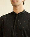 alt message - Manyavar Men Ebony Black Kurta Set with Embroidered Neckline image number 1