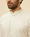 alt message - Manyavar Men Warm White Floral Chikankari Embroidered Kurta Set image number 1