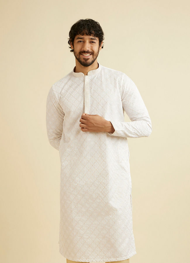 alt message - Manyavar Men Warm White Jaal Patterned Kurta Set image number 0