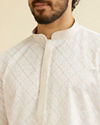 alt message - Manyavar Men Warm White Jaal Patterned Kurta Set image number 1