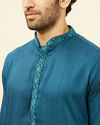 alt message - Manyavar Men Azure Blue Embroidered Placket Kurta Set image number 1