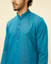 alt message - Manyavar Men Teal Blue Self Patterned Kurta Set image number 1