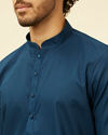 alt message - Manyavar Men Turquoise Blue Self Patterned Kurta Set image number 1