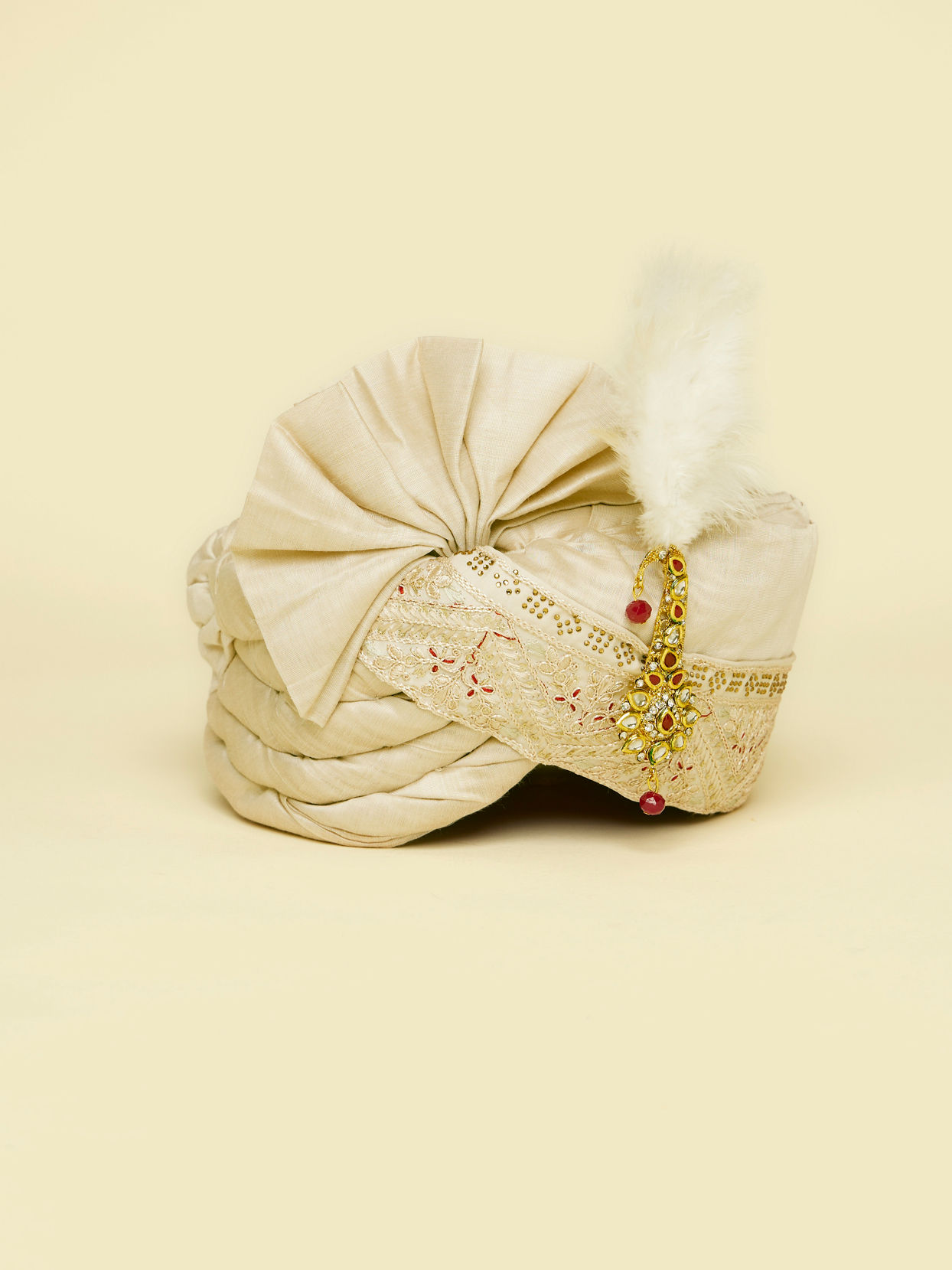 Manyavar Men Warm Cream Safa Embellished with Peacock Brooch