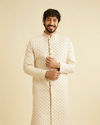 alt message - Manyavar Men Golden Cream Patterned Sherwani Set image number 0