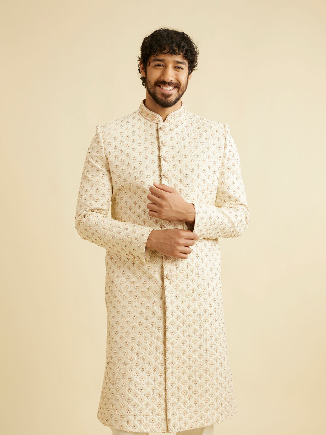 alt message - Manyavar Men Golden Cream Patterned Sherwani Set image number 0