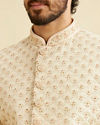 alt message - Manyavar Men Golden Cream Patterned Sherwani Set image number 1