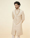 alt message - Manyavar Men Biscuit Beige Floral Jaal Patterned Sherwani Set image number 0