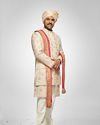 alt message - Manyavar Men Warm White Floral Trellis Patterned Sherwani Set image number 0