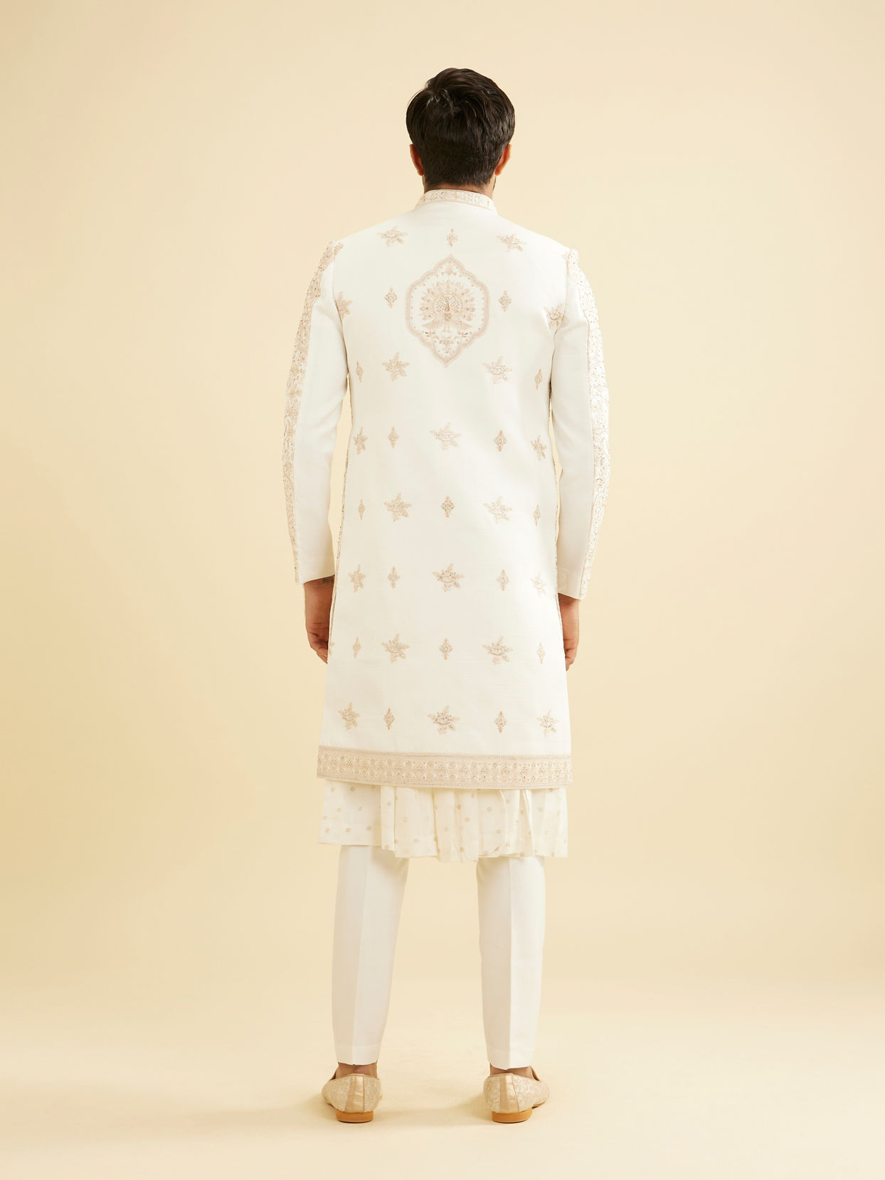 Manyavar Men Cream Beige Zari Embroidered Sherwani Set with Peacock