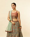 alt message - Mohey Women Sea Green and Rust Floral Printed Lehenga image number 1