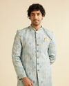 alt message - Manyavar Men Light Blue Conch Shell Patterned Kurta Set image number 0