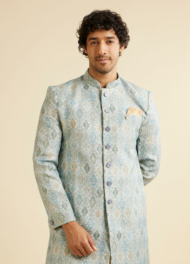 alt message - Manyavar Men Light Blue Conch Shell Patterned Kurta Set image number 0