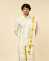 alt message - Manyavar Men Bright Cream Detailed Traditional South Indian Shirt and Veshti Set image number 0