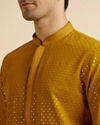 alt message - Manyavar Men Mustard Self Patterned Mirror Work Kurta Set image number 1