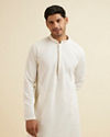 alt message - Manyavar Men Warm White Self Patterned Mirror Work Kurta Set image number 0