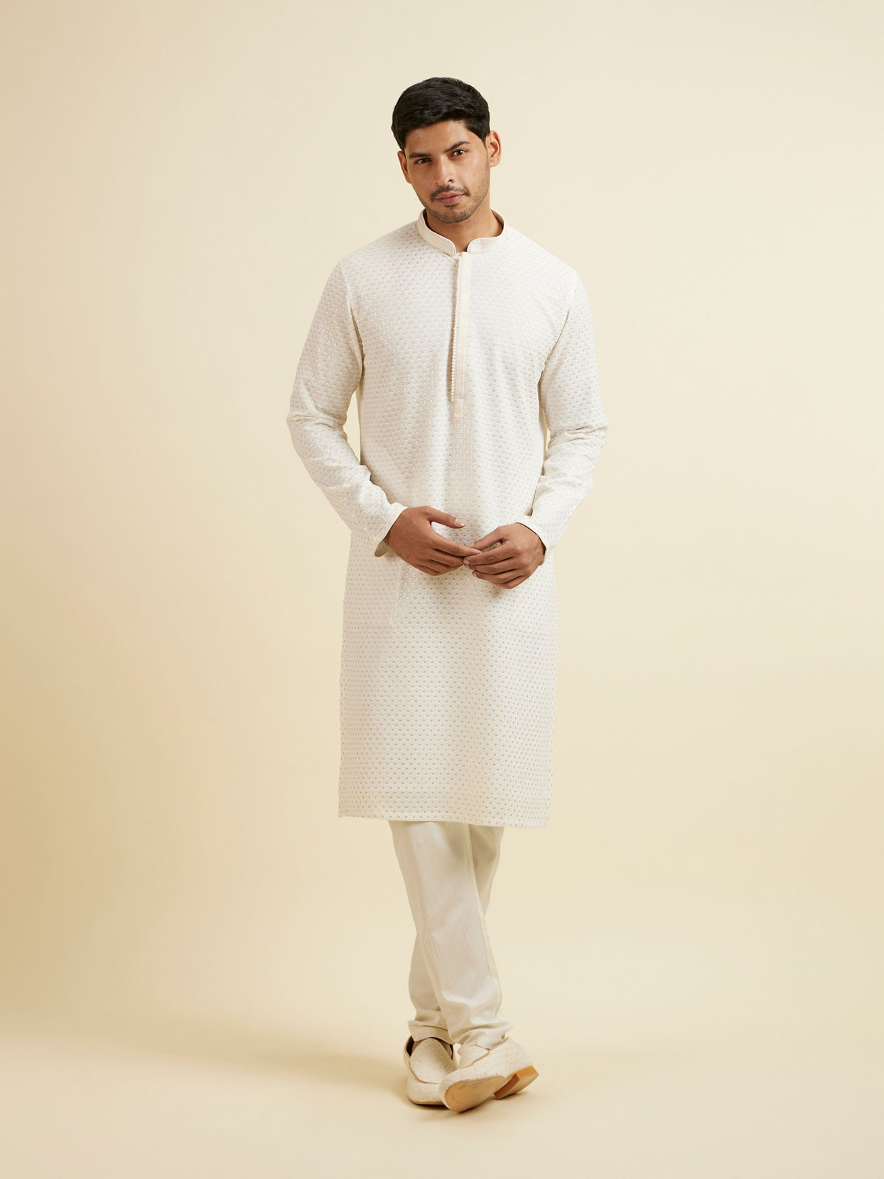 alt message - Manyavar Men Warm White Self Patterned Mirror Work Kurta Set image number 2