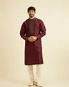 Manyavar Men Wine Red Plain Classic Kurta Set with Embroidered Neckline