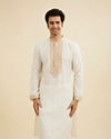 Manyavar Men Warm White Kurta Set with Bel Buti Embroidered Neckline