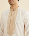Manyavar Men Warm White Kurta Set with Bel Buti Embroidered Neckline