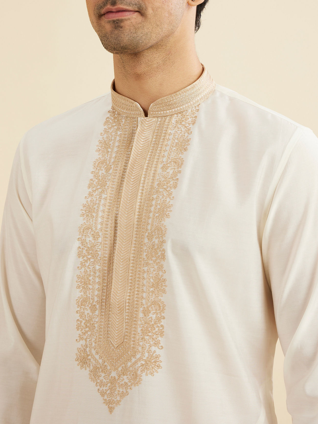 Manyavar Men Warm White Kurta Set with Bel Buti Embroidered Neckline