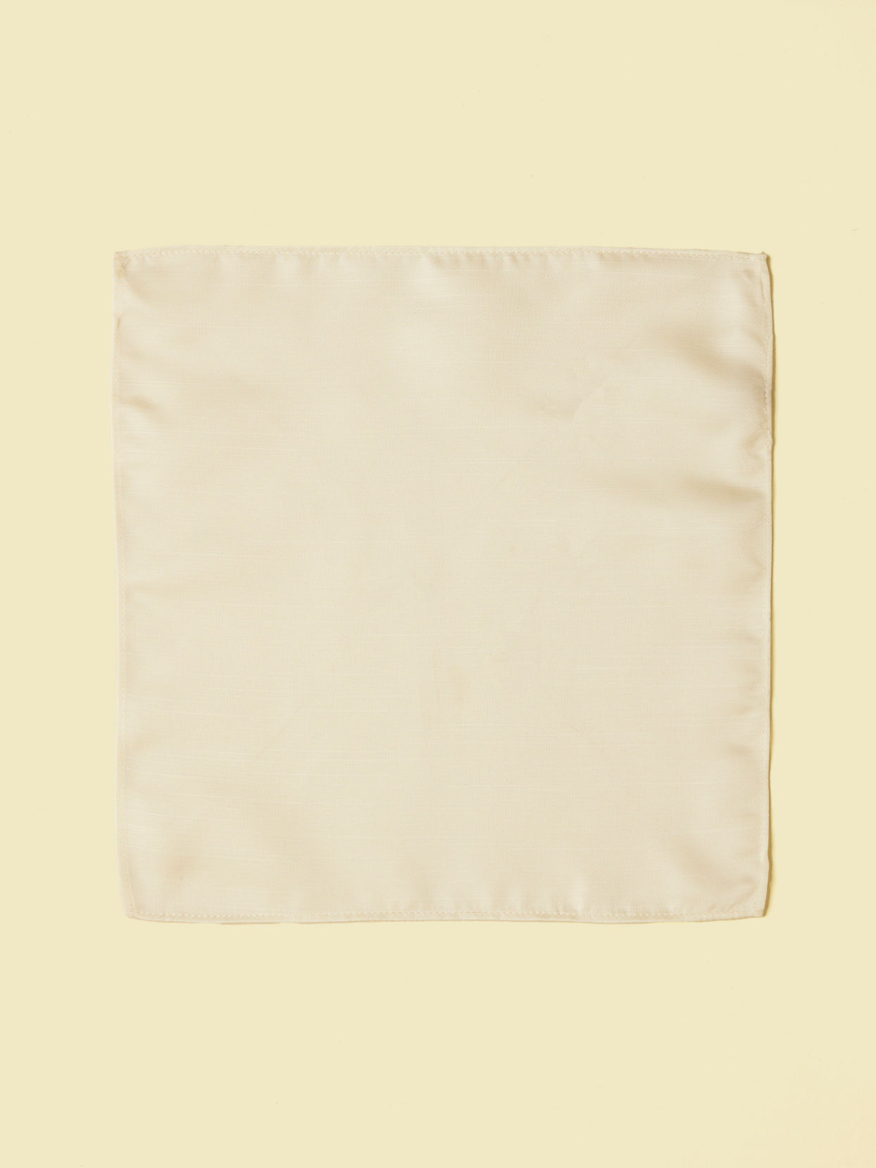 alt message - Manyavar Men Warm White Satin Pocket Square image number 1