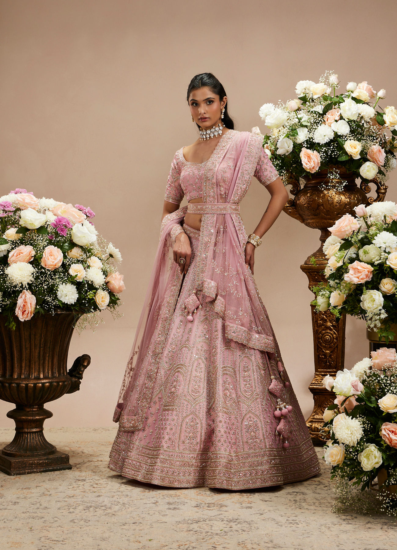 Twamev Women Baby Pink Zari Embroidered Lehenga with Floral And Buta Motifs And Pillow Trim Latkans