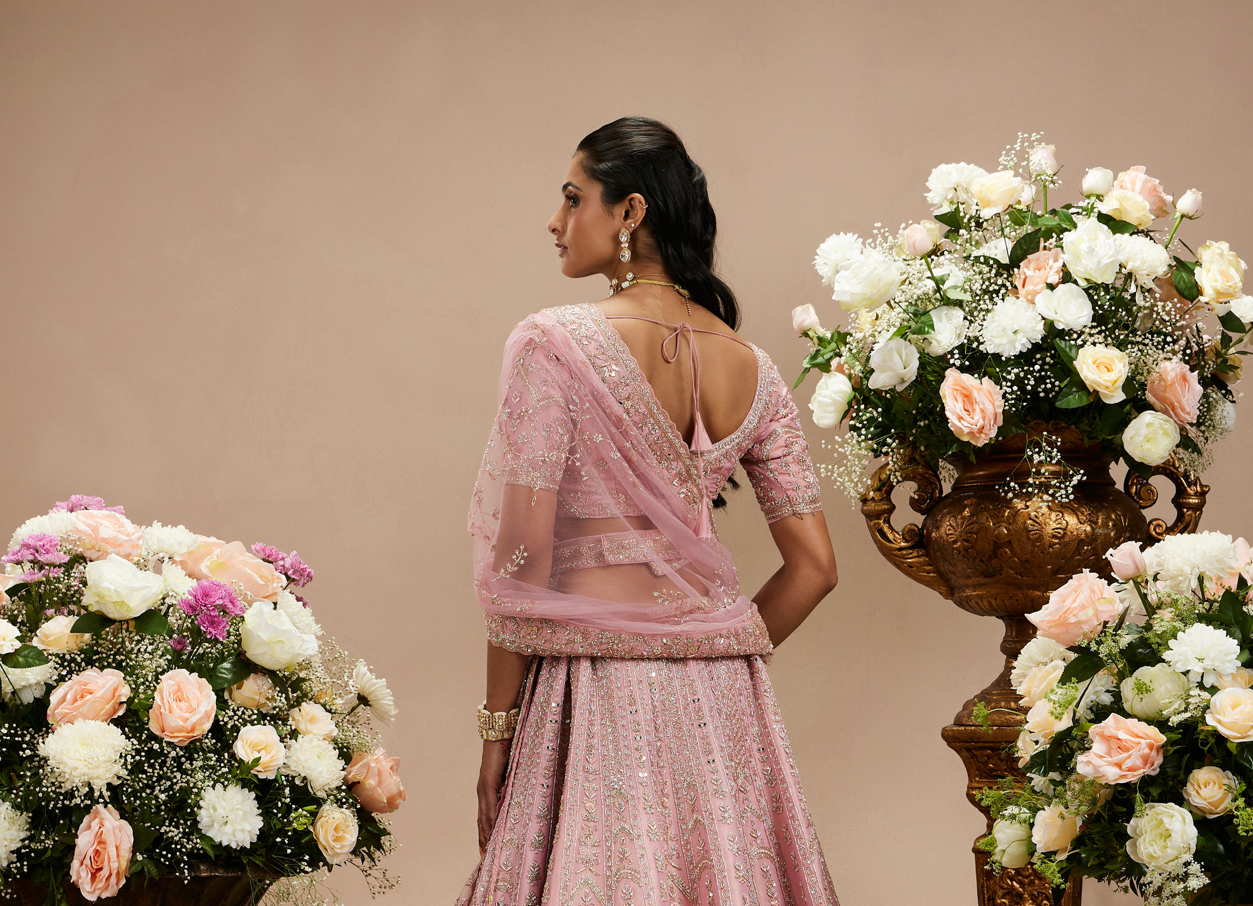 Twamev Women Baby Pink Zari Embroidered Lehenga with Floral And Buta Motifs And Pillow Trim Latkans