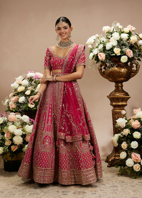 Twamev Women Rani Pink Zari Embroidered Lehenga with Floral And Buta Motifs And Pillow Trim Latkans
